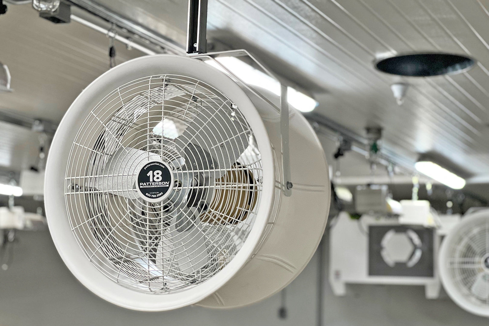 18-inch industrial circulation fan mounted in a cultivation room to improve air movement and reduce condensation on ceiling surfaces