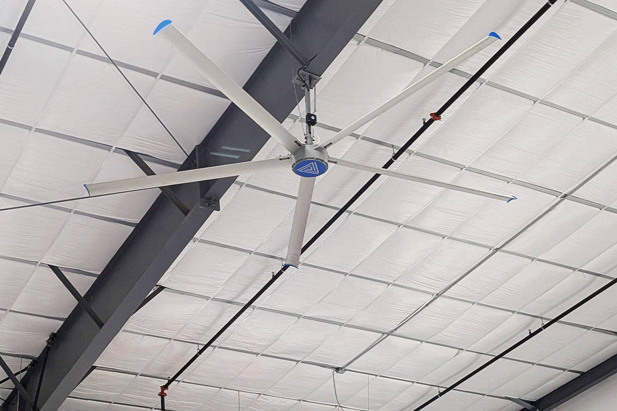 Large HVLS ceiling fan installed with high ceilings, providing airflow and ventilation across the facility