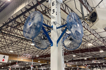 Dual Patterson industrial fans mounted on a warehouse column for high-volume airflow