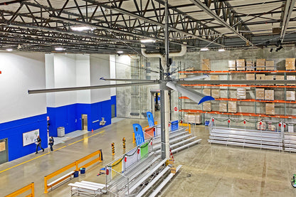 High-volume low-speed ceiling fan installed in a warehouse to improve air circulation and cooling