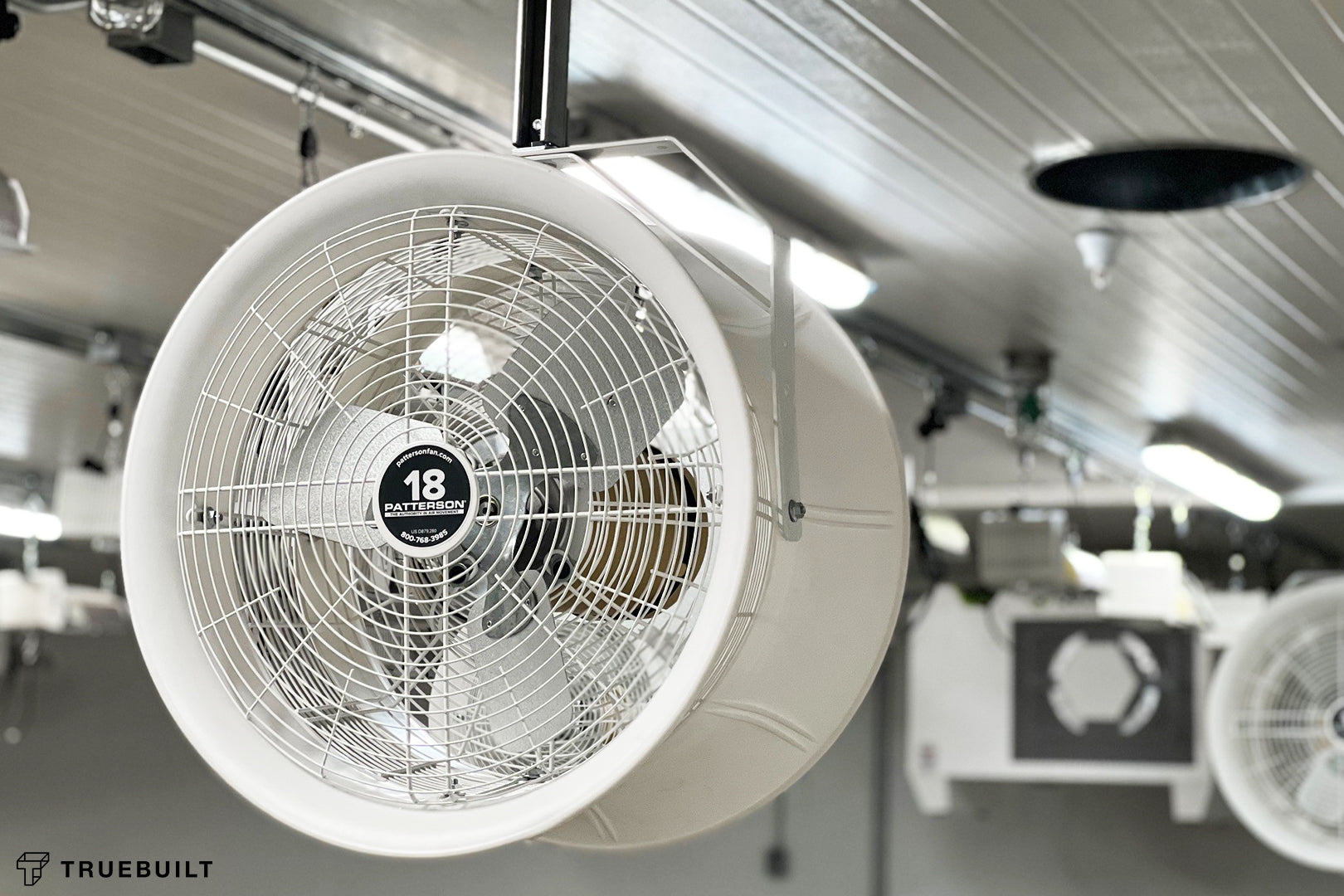 18-inch industrial circulation fan mounted in a cultivation room to improve air movement and reduce condensation on ceiling surfaces