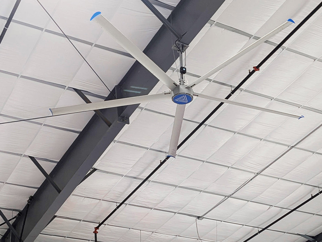 Large HVLS ceiling fan installed with high ceilings, providing airflow and ventilation across the facility