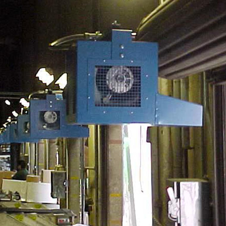 Blue industrial high-velocity fans mounted above a production line inside a manufacturing facility
