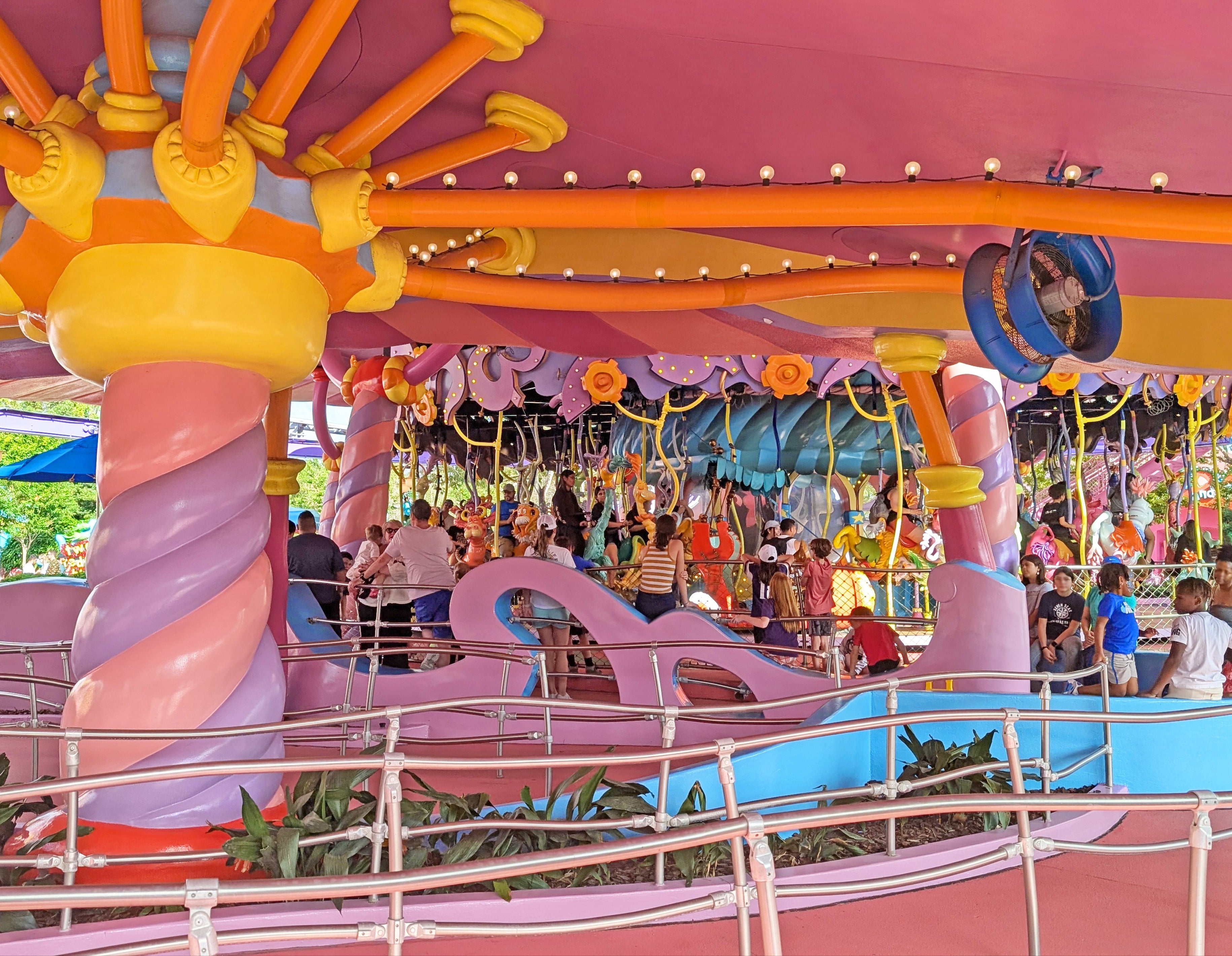 Fan to cool people while standing in line at amusement park.