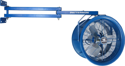 Patterson industrial fan mounted on extended dual-arm wall bracket