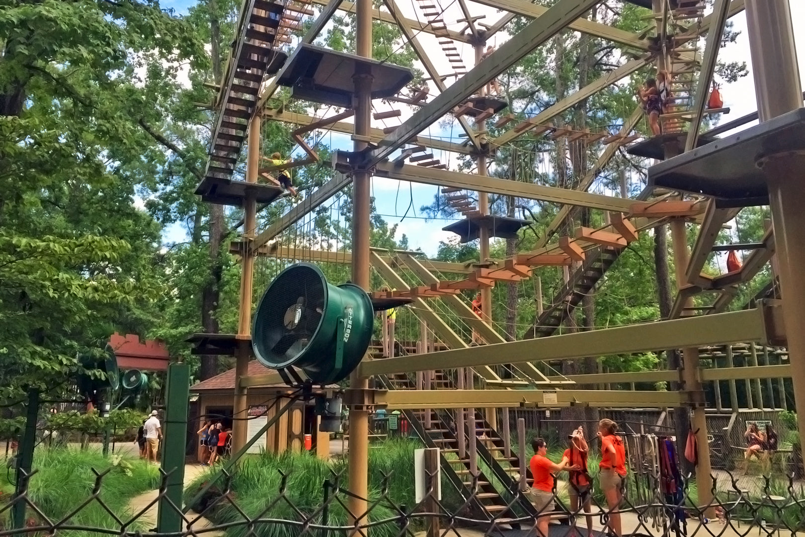 Large outdoor colling fan installed near a ropes course for guest comfort
