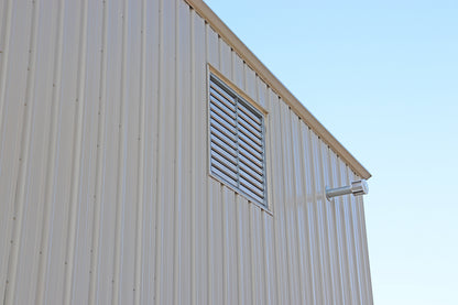 Exterior metal louver vent used for airflow and ventilation on an industrial facility